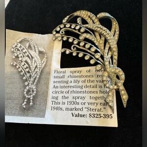 Book piece. This is a beautiful Lily of the valley pin.